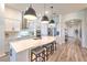 Beautiful kitchen with large island, pendant lights, stainless appliances and breakfast bar at 10308 Malvasia Ave, Riverview, FL 33578