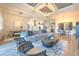 Open-concept living room with adjacent dining and kitchen areas, perfect for modern living at 10308 Malvasia Ave, Riverview, FL 33578