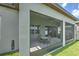 Enclosed patio with ceiling fan, screened windows, and outdoor seating at 10308 Malvasia Ave, Riverview, FL 33578