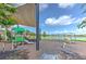 The community playground features lake views, swings and a play structure at 10308 Malvasia Ave, Riverview, FL 33578