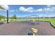 Community playground with swings and splash area, featuring a picturesque lakeside setting and ample green space at 10308 Malvasia Ave, Riverview, FL 33578
