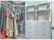 Organized walk-in closet with shelves, drawers, and hanging space, complete with stylish baskets at 10308 Malvasia Ave, Riverview, FL 33578