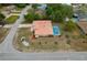 Stunning aerial view of the home, showcasing the pool, tile roof, landscaping, and well-maintained yard at 11411 Terrell, Spring Hill, FL 34606