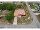 Aerial view showcasing a home with a pool and lush surrounding greenery at 11411 Terrell, Spring Hill, FL 34606