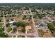 An aerial view of a charming single-Gathering home featuring a private pool and spacious backyard in a serene neighborhood at 11411 Terrell, Spring Hill, FL 34606