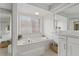 Bright bathroom with a large tub, vanity, and tiled floor at 11411 Terrell, Spring Hill, FL 34606