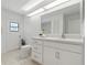 Bright bathroom featuring an ample vanity, neutral tile flooring, and new toilet at 11411 Terrell, Spring Hill, FL 34606