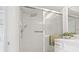 Modern bathroom features a shower with sleek sliding glass doors and rainfall showerhead at 11411 Terrell, Spring Hill, FL 34606