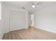 Clean bedroom features neutral walls, wood-look floors and built-in closet at 11411 Terrell, Spring Hill, FL 34606