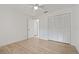Clean bedroom features neutral walls, wood-look floors and built-in closet at 11411 Terrell, Spring Hill, FL 34606
