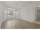 Bright dining area with bay windows and chandelier at 11411 Terrell, Spring Hill, FL 34606