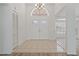 Bright foyer with tile flooring, double entry doors and transom window at 11411 Terrell, Spring Hill, FL 34606