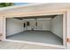 Spacious two-car garage with clean epoxy flooring, utility sink and storage space at 11411 Terrell, Spring Hill, FL 34606