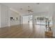 Spacious living room with wood flooring, fireplace, and pool view through sliding glass doors at 11411 Terrell, Spring Hill, FL 34606