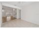Open concept living space with breakfast bar, foyer, and bright lighting at 11411 Terrell, Spring Hill, FL 34606