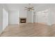 Open living room has a fireplace and flows into the entry and living areas at 11411 Terrell, Spring Hill, FL 34606