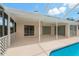 Lovely screened patio with a ceiling fan providing access to the pool area at 11411 Terrell, Spring Hill, FL 34606