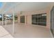 Large screened-in patio with fan, overlooking the backyard and with access to the pool at 11411 Terrell, Spring Hill, FL 34606