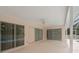 Spacious screened patio with ceiling fan and sliding glass doors overlooking the pool at 11411 Terrell, Spring Hill, FL 34606