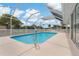 Beautiful screened-in pool with clear blue water and white trim at 11411 Terrell, Spring Hill, FL 34606