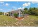 Inviting screened-in pool with a well-maintained yard, perfect for outdoor relaxation and enjoyment at 11411 Terrell, Spring Hill, FL 34606