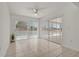 Bright sunroom has tile flooring and sliding doors leading to the pool at 11411 Terrell, Spring Hill, FL 34606
