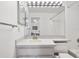 Bright bathroom features a large mirror, white countertop, and a combined shower and bathtub at 11613 Sunshine Pond Rd, Tampa, FL 33635
