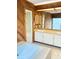 Bathroom featuring a double sink vanity, wood paneling, and a jetted tub at 12206 N 53Rd St, Temple Terrace, FL 33617