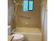 The bathroom has a tiled shower/tub and a handrail at 12206 N 53Rd St, Temple Terrace, FL 33617