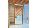 Bathroom showcasing a walk-in closet, double sink vanity, wood paneling, and jetted tub at 12206 N 53Rd St, Temple Terrace, FL 33617