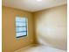 The bedroom has neutral walls, carpet, and a window at 12206 N 53Rd St, Temple Terrace, FL 33617