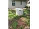 Exterior ground shot of a generator on a well-kept lawn at 12206 N 53Rd St, Temple Terrace, FL 33617