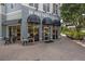 Charming coffee shop exterior with outdoor seating provides a cozy and inviting atmosphere at 12209 Glencliff Cir, Tampa, FL 33626