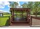 Community gazebo surrounded by black fence and green landscape at 12209 Glencliff Cir, Tampa, FL 33626