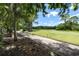 Scenic view of a golf course path and green with trees at 12209 Glencliff Cir, Tampa, FL 33626