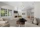 Spacious living room showcasing a fireplace, ample seating, and natural light with an open floor plan at 12209 Glencliff Cir, Tampa, FL 33626