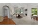 Bright living room with large windows, a fireplace, neutral furnishings and vaulted ceiling at 12209 Glencliff Cir, Tampa, FL 33626
