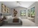 Serene main bedroom with golf view, large windows, plush carpeting, and modern decor at 12209 Glencliff Cir, Tampa, FL 33626