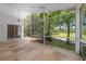 Covered and screened outdoor patio space overlooking lush landscape and a golf course at 12209 Glencliff Cir, Tampa, FL 33626