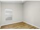 Bedroom featuring hardwood floors, vaulted ceiling and a window with blinds at 12335 Glenfield Ave, Tampa, FL 33626