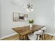 Elegant dining room with a wooden table, comfortable chairs, and stylish decor at 12335 Glenfield Ave, Tampa, FL 33626