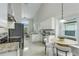 Well-equipped kitchen featuring modern appliances, granite countertops, and a cozy breakfast nook at 12335 Glenfield Ave, Tampa, FL 33626
