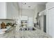 Spacious kitchen featuring granite counters, stainless appliances, and a bright, airy atmosphere at 12335 Glenfield Ave, Tampa, FL 33626