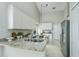 Modern kitchen with granite countertops, stainless steel appliances, and ample cabinet space at 12335 Glenfield Ave, Tampa, FL 33626