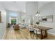 Bright and airy living room with hardwood floors, high ceilings, and an open floor plan at 12335 Glenfield Ave, Tampa, FL 33626
