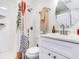 Bright bathroom with a white vanity, a round mirror, and a shower with stylish curtain at 1243 55Th N Ave, St Petersburg, FL 33703