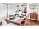 Inviting dining room featuring a stylish wood table set for dinner, complemented by modern decor and natural light at 1243 55Th N Ave, St Petersburg, FL 33703