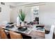 Bright dining room with a wooden table set for six, featuring modern chairs and decor, perfect for Gathering meals at 1243 55Th N Ave, St Petersburg, FL 33703