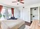 Bright main bedroom with access to the backyard patio, featuring ample closet space and modern design elements at 1243 55Th N Ave, St Petersburg, FL 33703
