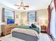 Cozy main bedroom with a ceiling fan, neutral tones, and curtains, designed for relaxation and rest at 1243 55Th N Ave, St Petersburg, FL 33703